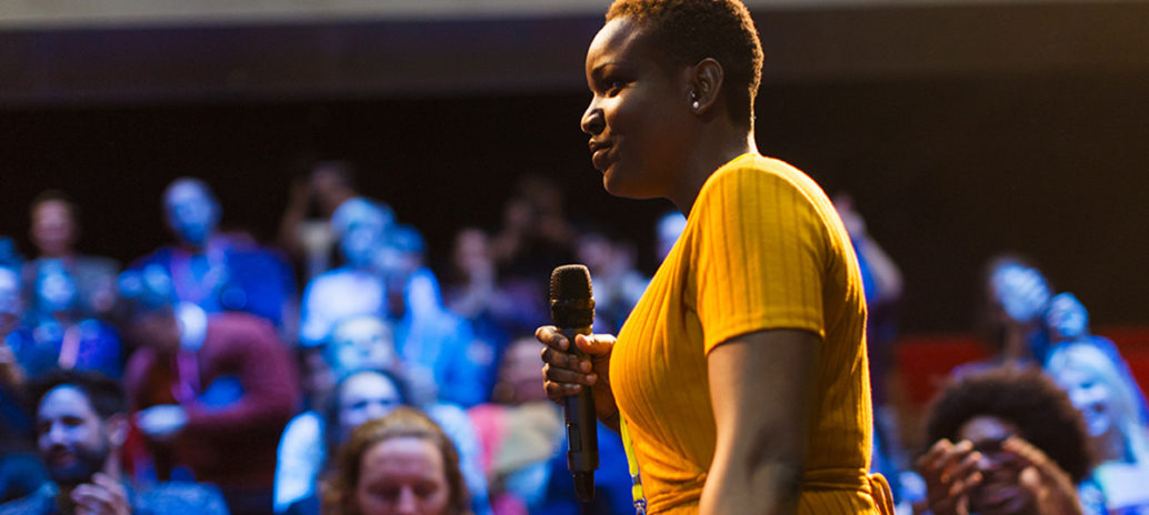 black woman talking during a conference