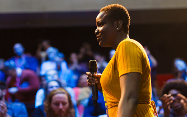 black woman talking during a conference