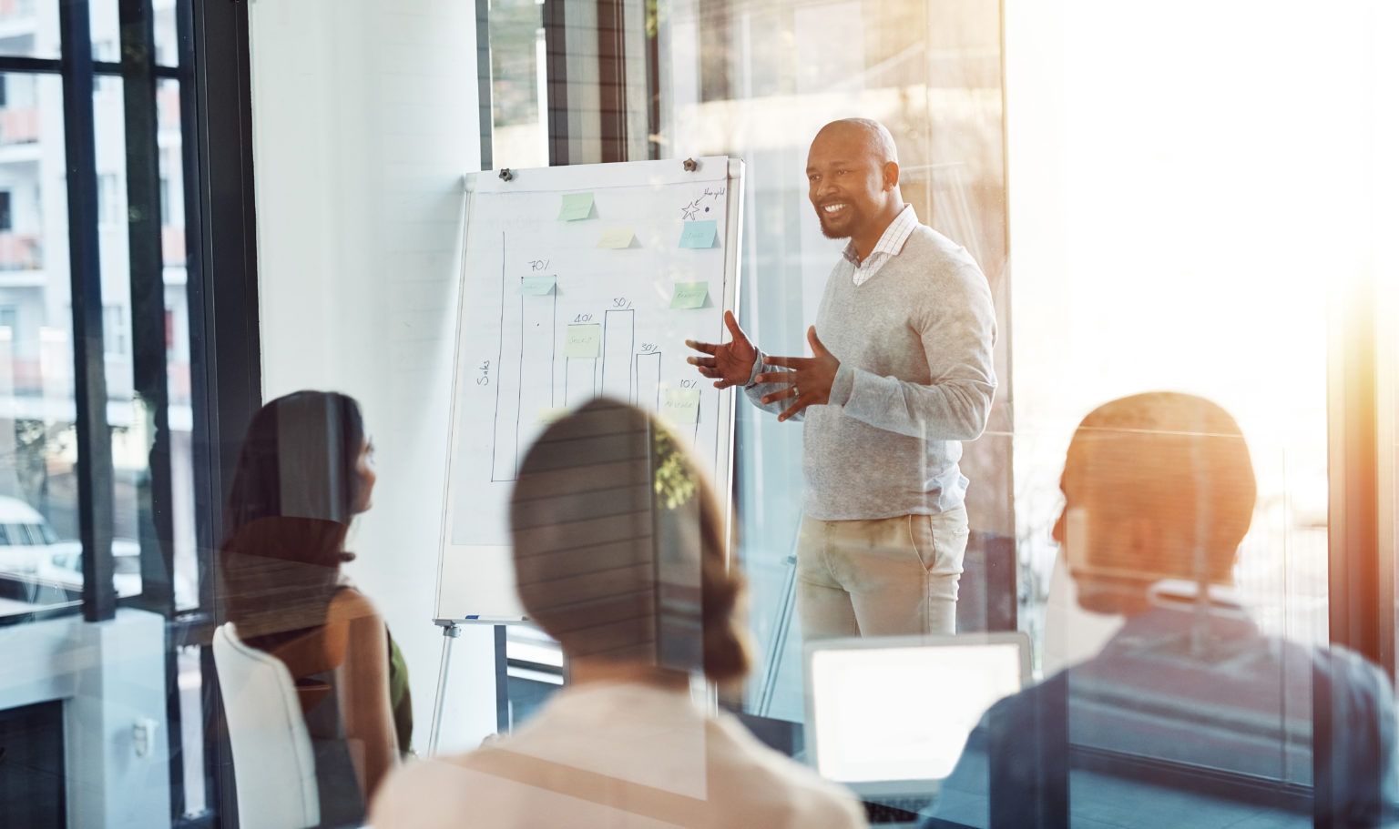 man presenting with a graphic whiteboard