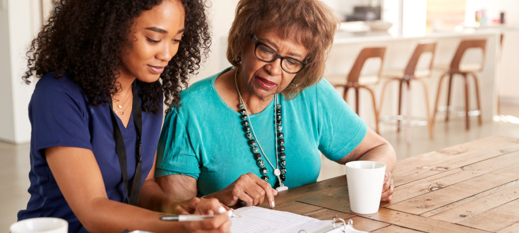 health provider helping older woman